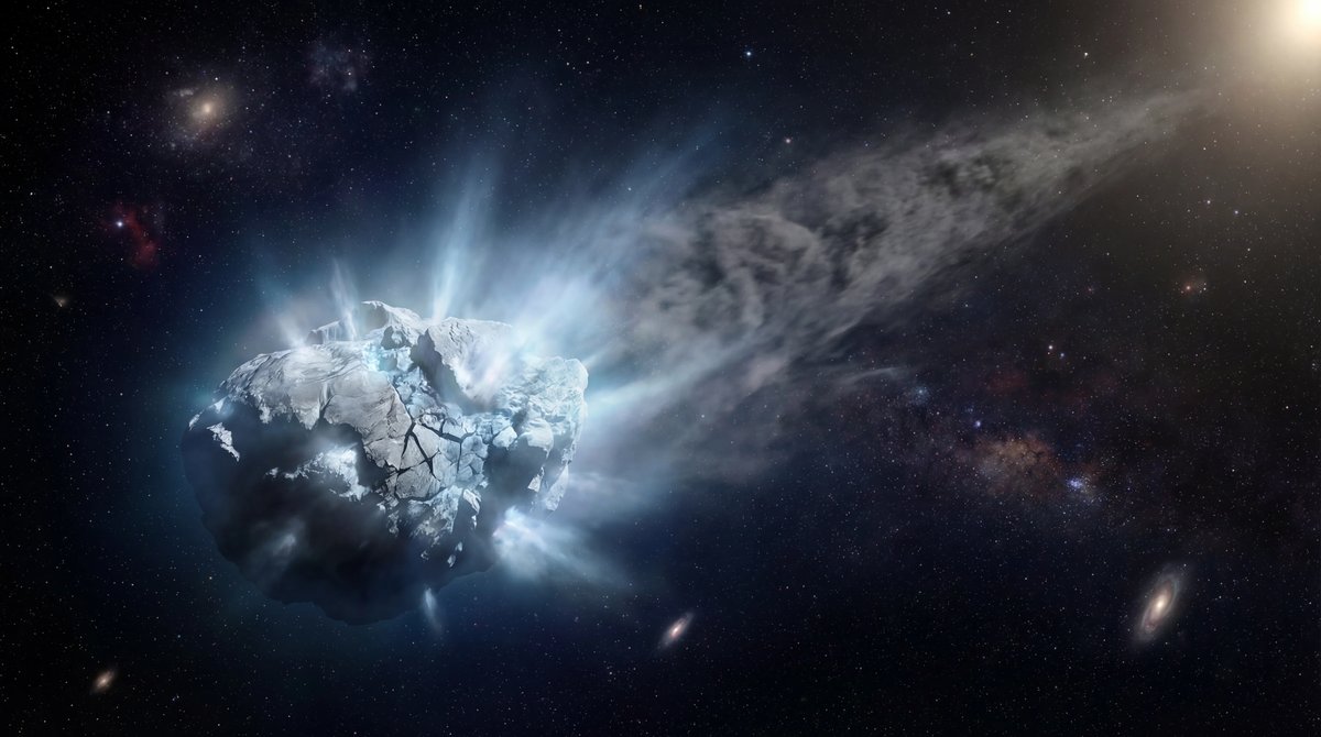 A bright, icy comet zooming through space, emitting a large glowing blue and white tail of gas and vapor.