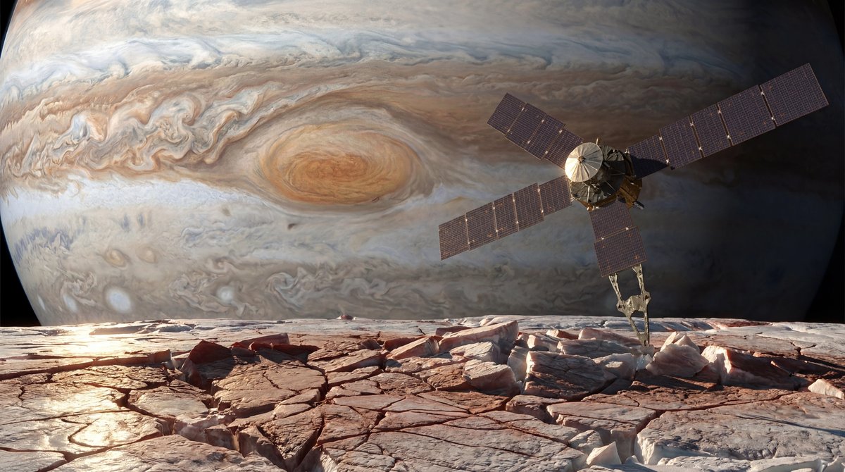 Juno spacecraft orbiting Europa's cracked icy crust with Jupiter's swirling storms in the background.