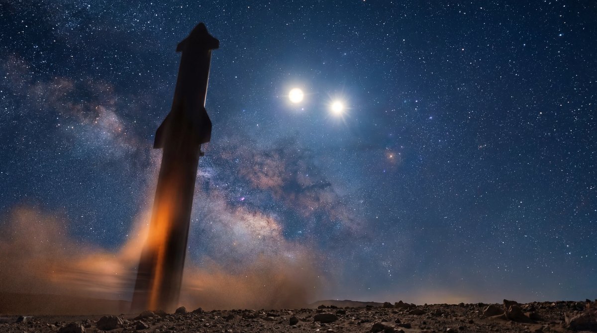 Silhouette of a large rocket against a starry night sky featuring two bright planets, Jupiter and Venus, shining together.