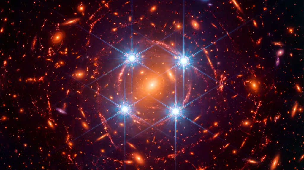 Four bright points of light arranged in a cross around a central galaxy, set against a deep black sky filled with distant stars.